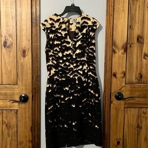 Antonio Melani dress accented with gold buttons. Smoke free home